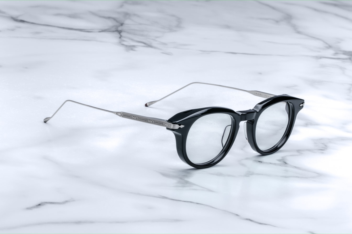 Side profile of Jacques Marie Mage Crevel in Noir showing sculpted temples, signature metal hinges, and smooth black acetate, available at WINK Optometrists.