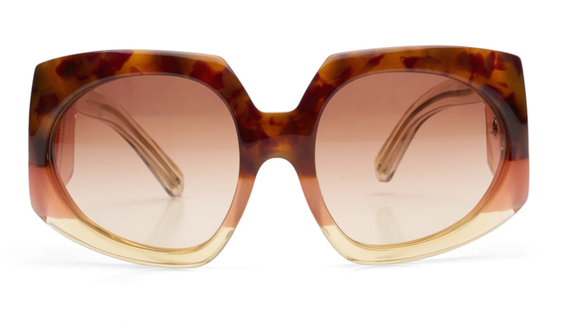 Front view of Jacques Marie Mage Duval Sunfade sunglasses: oversized squared acetate frame with side shields, gradient brown lenses fading from a darker top to lighter bottom. The frame shows tortoiseshell and amber tones with hints of pink near the base