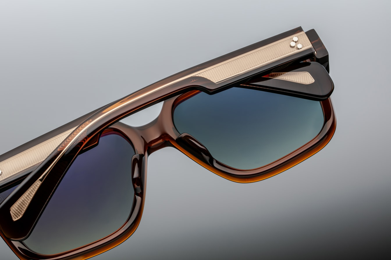 Close-up of Alfred Hickory glasses revealing intricate acetate texture and architectural endpiece design