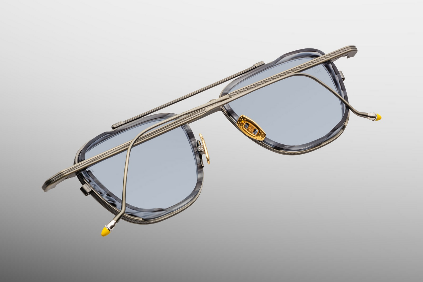 Back view of Jacques Marie Mage Ayrton Senna 1992 Antique Gunmetal sunglasses with temples folded, revealing the inner temple foil-stamped limited-edition serial and polished black interior finishes, available at WINK Optometrists