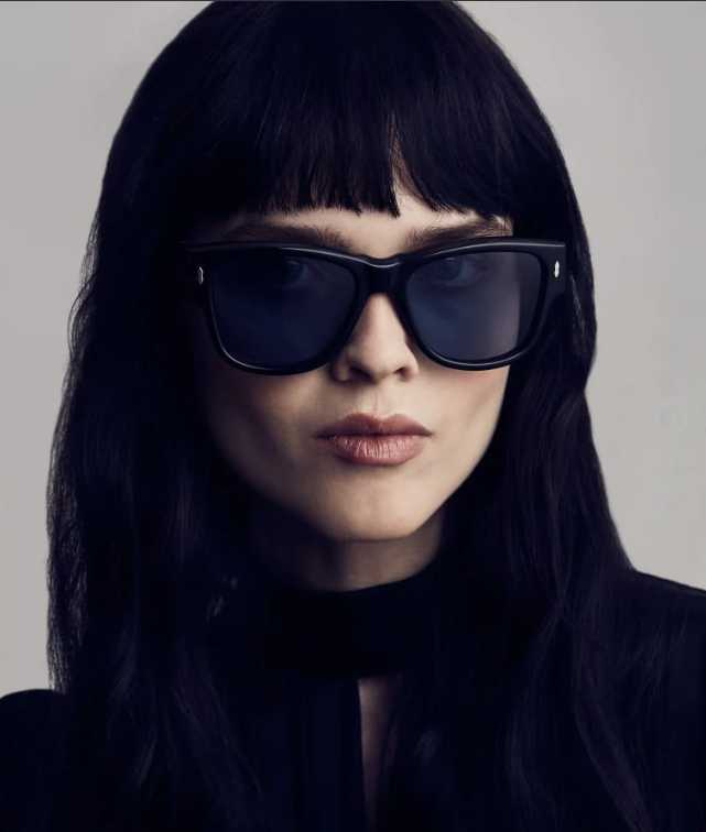 Model wearing Jacques Marie Mage Anita black sunglasses, showcasing the bold rectangular silhouette