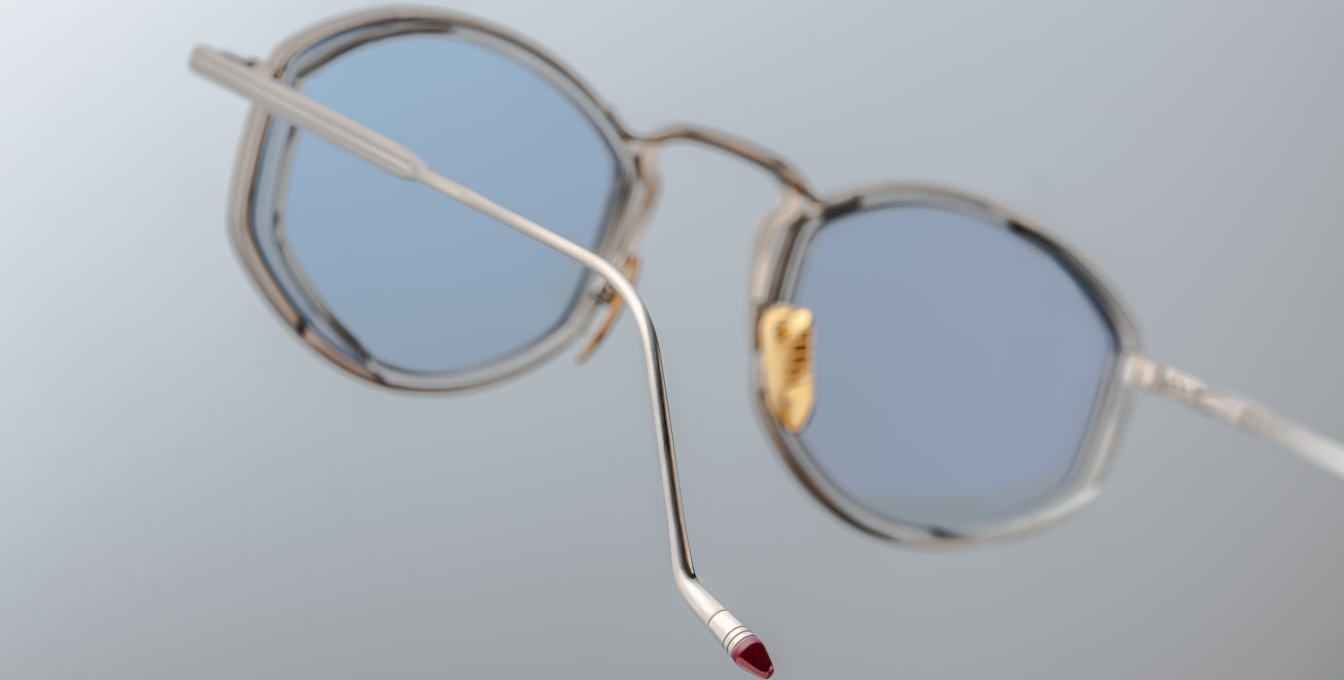 Close-up of temple on Jacques Marie Mage Aragon Silver Fog glasses, showing engraved titanium detail and tapered design. displayed at WINK Optometrists Melbourne