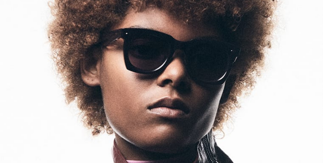 Model wearing Jacques Marie Mage Ava sunglasses with bold acetate frame and dark lenses