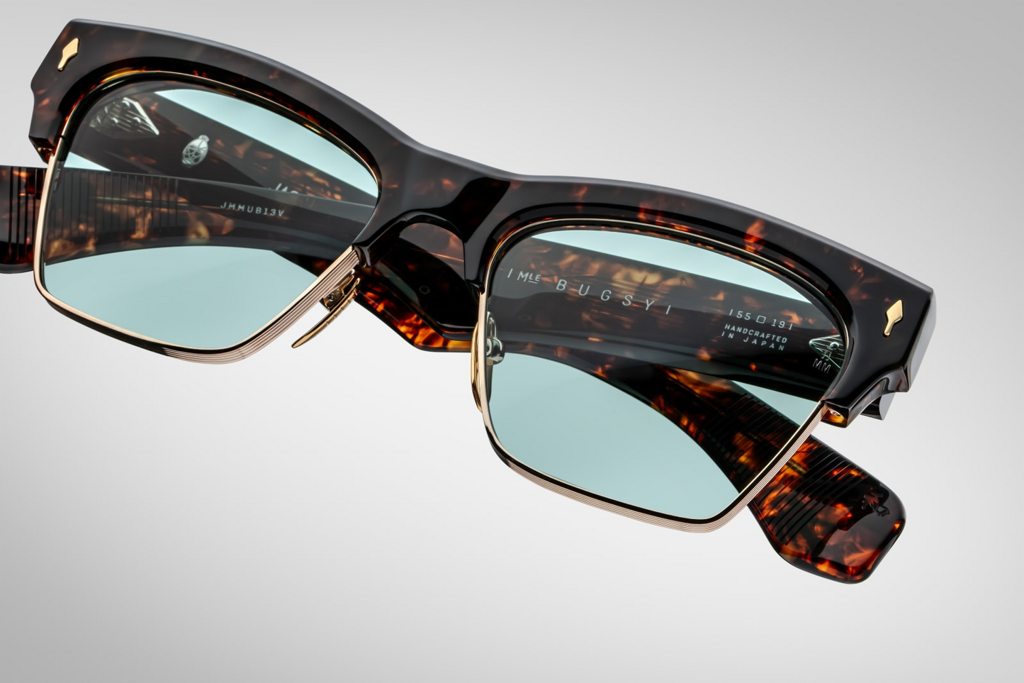 Top-down view of Jacques Marie Mage Bugsy Beau highlighting medium fit frame width, sculptural acetate browline merging into light‑gold beta titanium rim and seamless acetate‑metal integration
