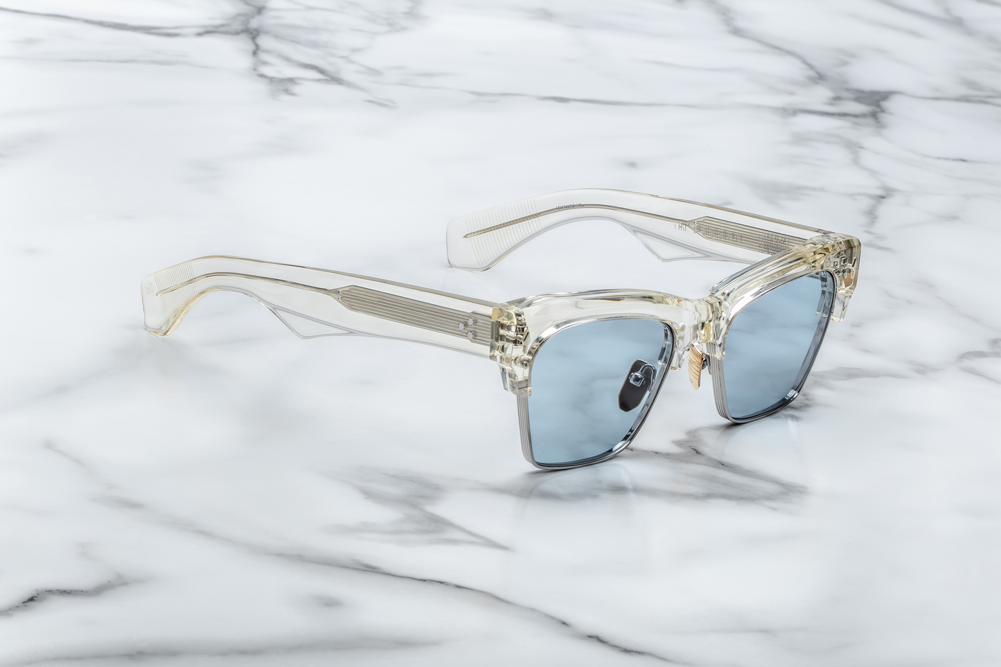 Side profile of Bugsy Brut highlighting exposed silver Cantilever wirecore within the acetate temple, silver tension‑secured 7‑barrel hairline hinge, and sculptural acetate detail