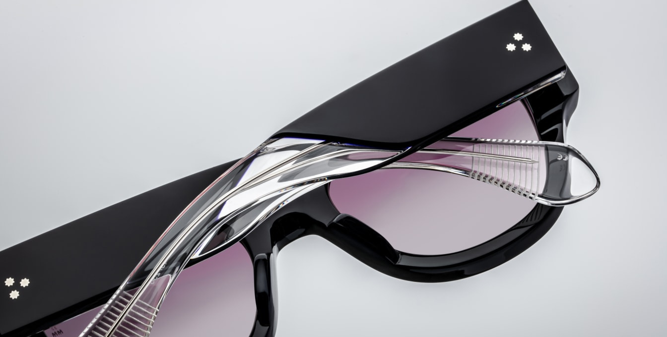 The Jacques Marie Mage Chelsea sunglasses feature distinctive sterling silver arrowhead front pins, which are often colloquially referred to as "star rivets" due to their unique shape and prominent position on the frame. These arrowhead pins are not only a design signature but also serve as a testament to the brand's commitment to craftsmanship and attention to detail.