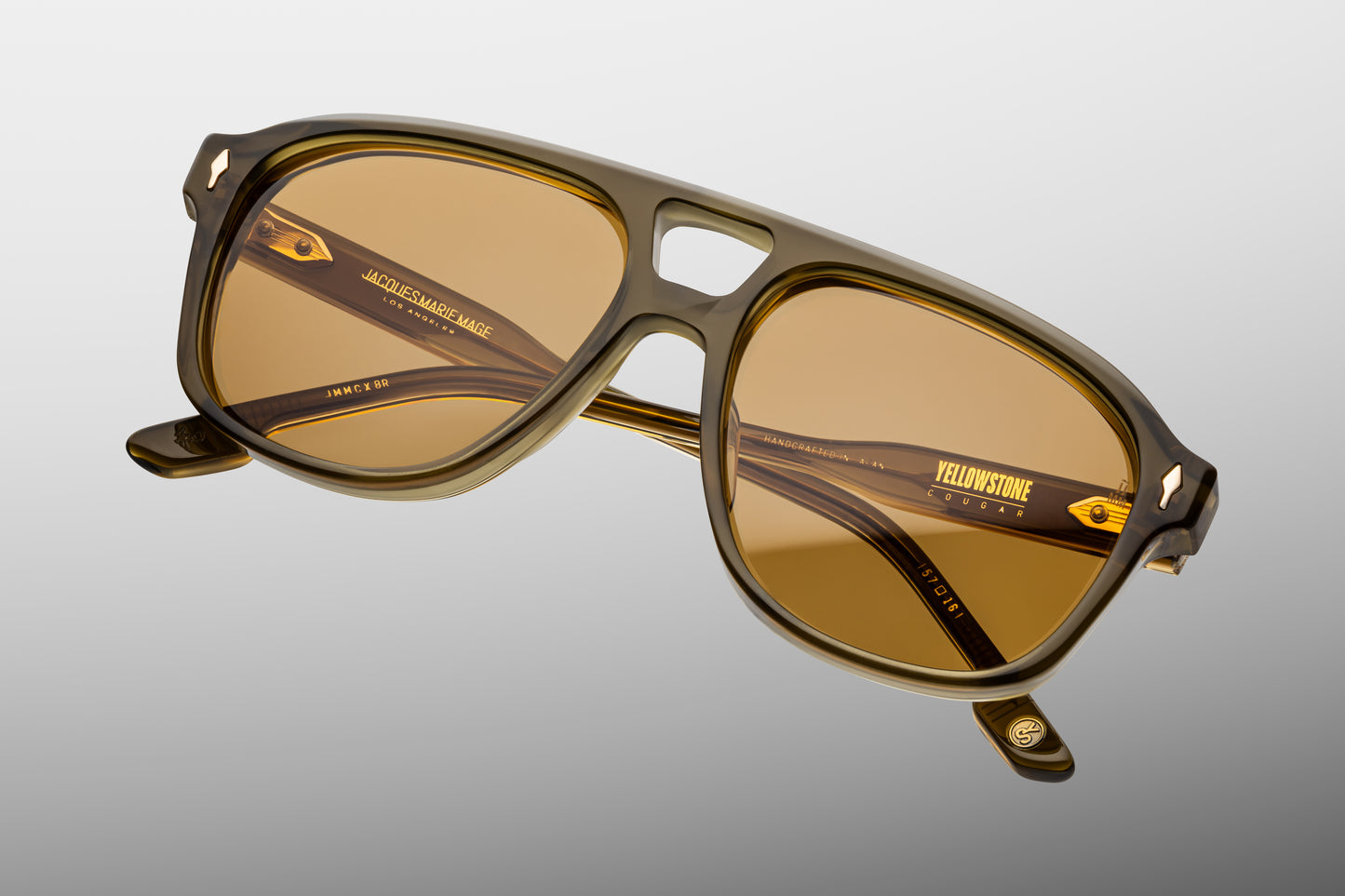 Front view. Slip through the undergrowth in sleek ‘80s-inspired spectacles named for the Cougar Creek Pack, whose domain once stretched across the Grayling Creek drainage in Yellowstone’s wild northwest. Balanced and bold, these refined navigators feature a slim silhouette and distinctive double-bridge, handcrafted from polished plant-based acetate in Green Moss. Complemented by lenses in Dandelion yellow, they feature our signature arrowhead front pins, custom 5-barrel hinges, and hairline-engraved 'Spiket