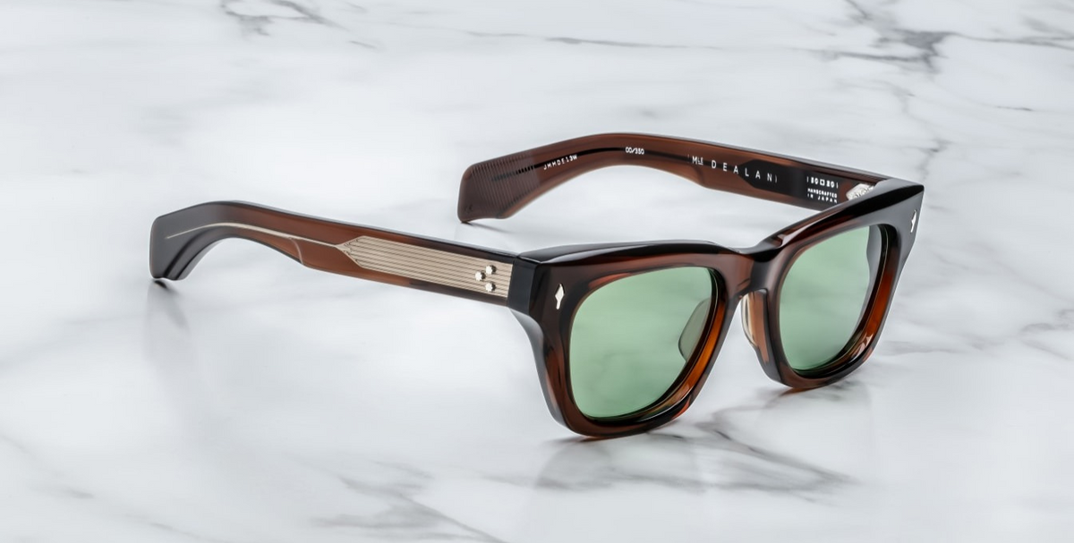 Side profile of Jacques Marie Mage Dealan sunglasses in Zoltar, highlighting the unique cut-out 100% beta titanium temples with acetate tips. The temples feature silver hardware and a tension-secured custom 7-barrel hinge, emphasizing the frame's luxurious craftsmanship