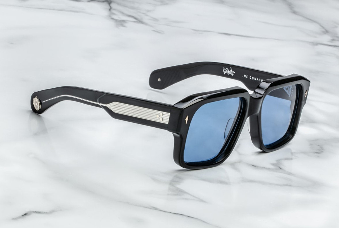 Side view of Jacques Marie Mage Donato Shadow sunglasses, highlighting the sculpted temples and luxurious Shadow acetate finish. The temples curve slightly for comfort and feature fine gold-tone metal accents, with Rossi’s signature symbol engraved at the temple tips, adding a unique, high-end touch