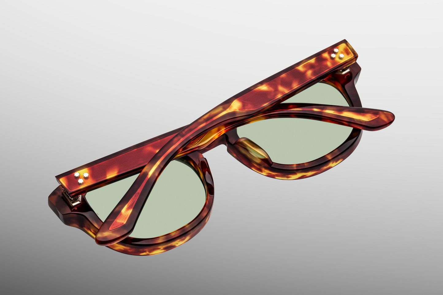 Interior of Dr. Dream Baltic — light-toned lenses framed by translucent Baltic acetate, inner temple marked with JMM hallmarks