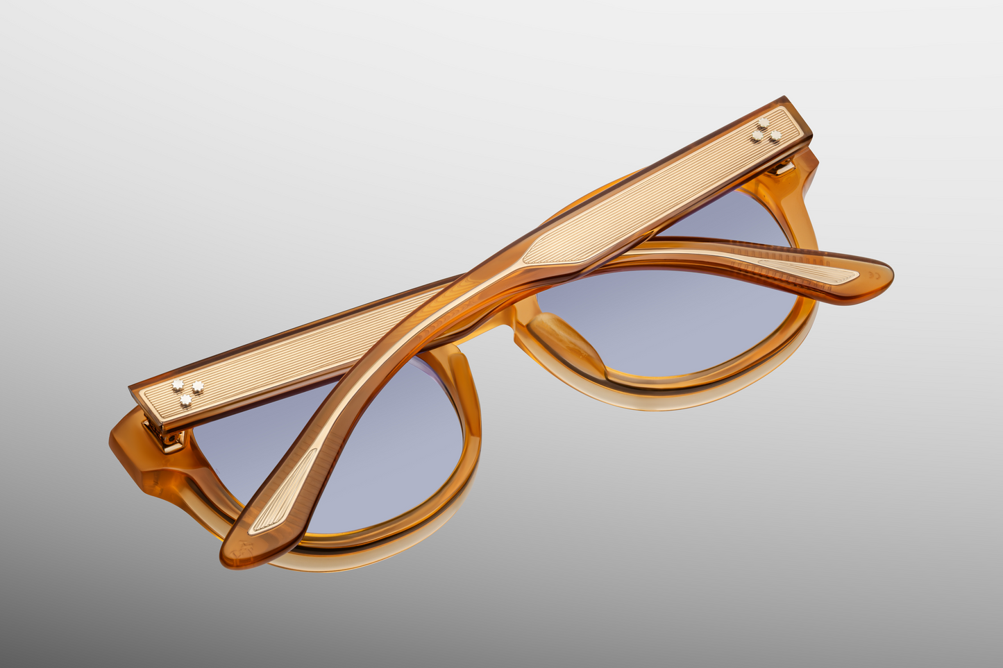 Interior of Dr. Dream Marigold — Marian‑blue Armorlite lenses framed by translucent marigold acetate, with inner‑temple JMM serial details.