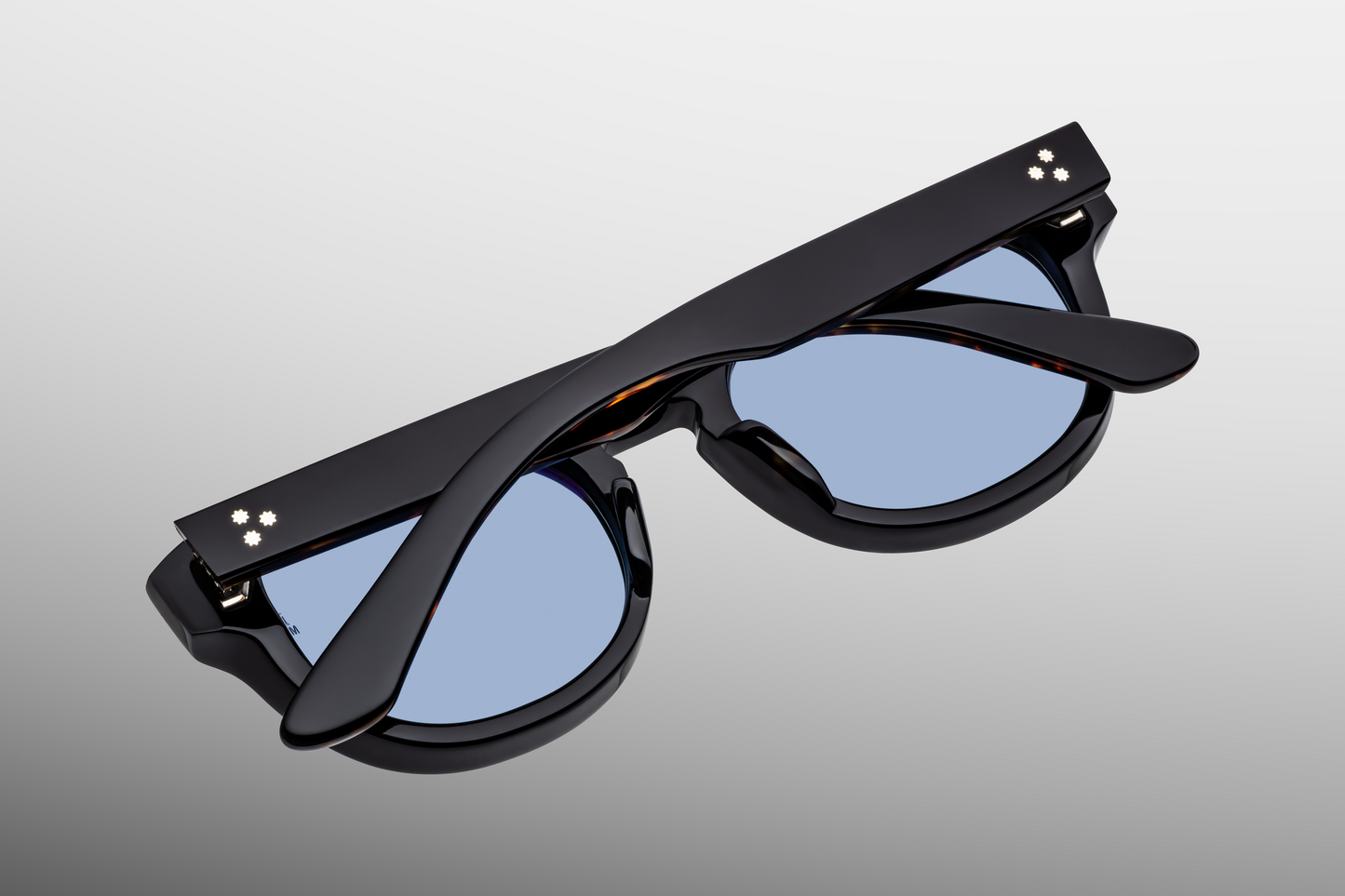 Rear view of Dr. Dream Noir — inside of the black acetate temples showing hidden wire-core and the clean finish of the interior, reflecting the refined John & Yoko aesthetic