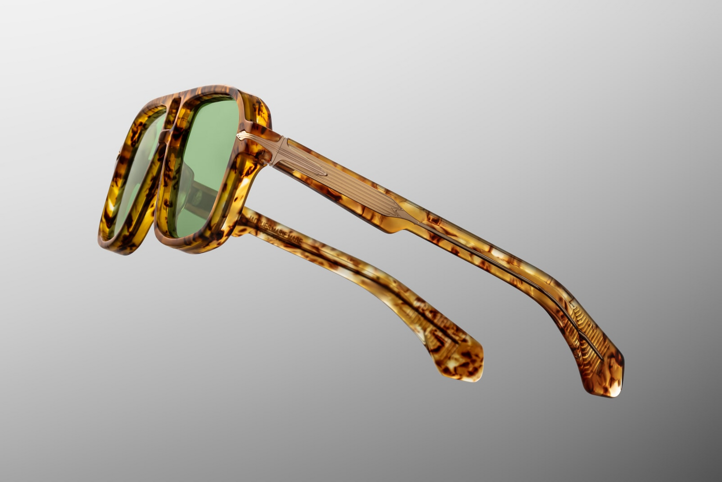 Temple detail of Jacques Marie Mage Elkhart Vintage Tort sunglasses with signature arrowhead pin and engraved wirecore – available at WINK Optometrists.