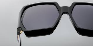 Close-up of the lenses of Jacques Marie Mage Grandfunk Black sunglasses, displaying the dark, gradient lenses set within the oversized round frame. The frame's clean, smooth lines and the lenses’ sharp contrast emphasize the modern and minimalistic design of the sunglasses