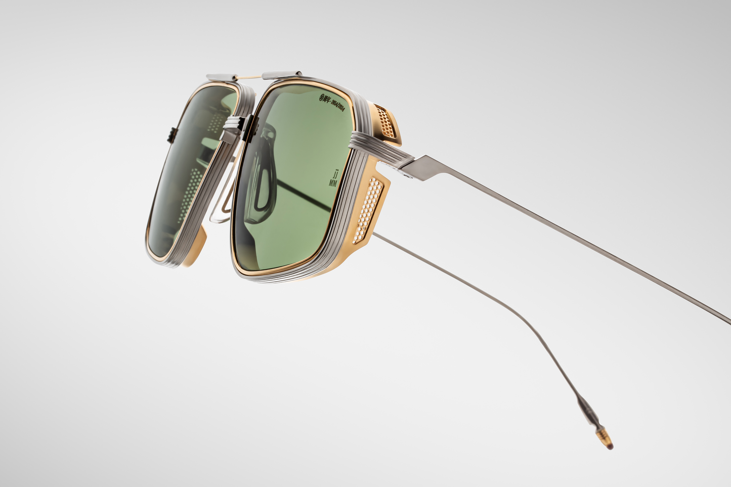 Side view of Jacques Marie Mage Jagger glasses in Electrum, showing the sculpted gold metal temples with finely engraved detailing and perforated metal side shields that add both style and sun protection.