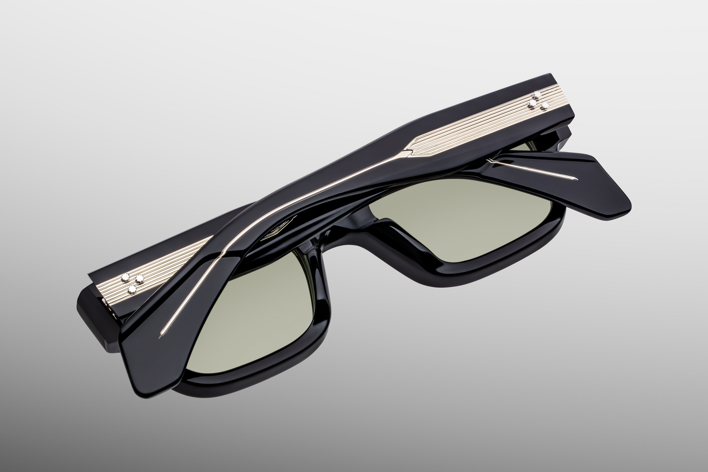 Temple detail of Jacques Marie Mage Jeff Cobra sunglasses with signature arrowhead pin and engraved metal wirecore – available at WINK Optometrists.