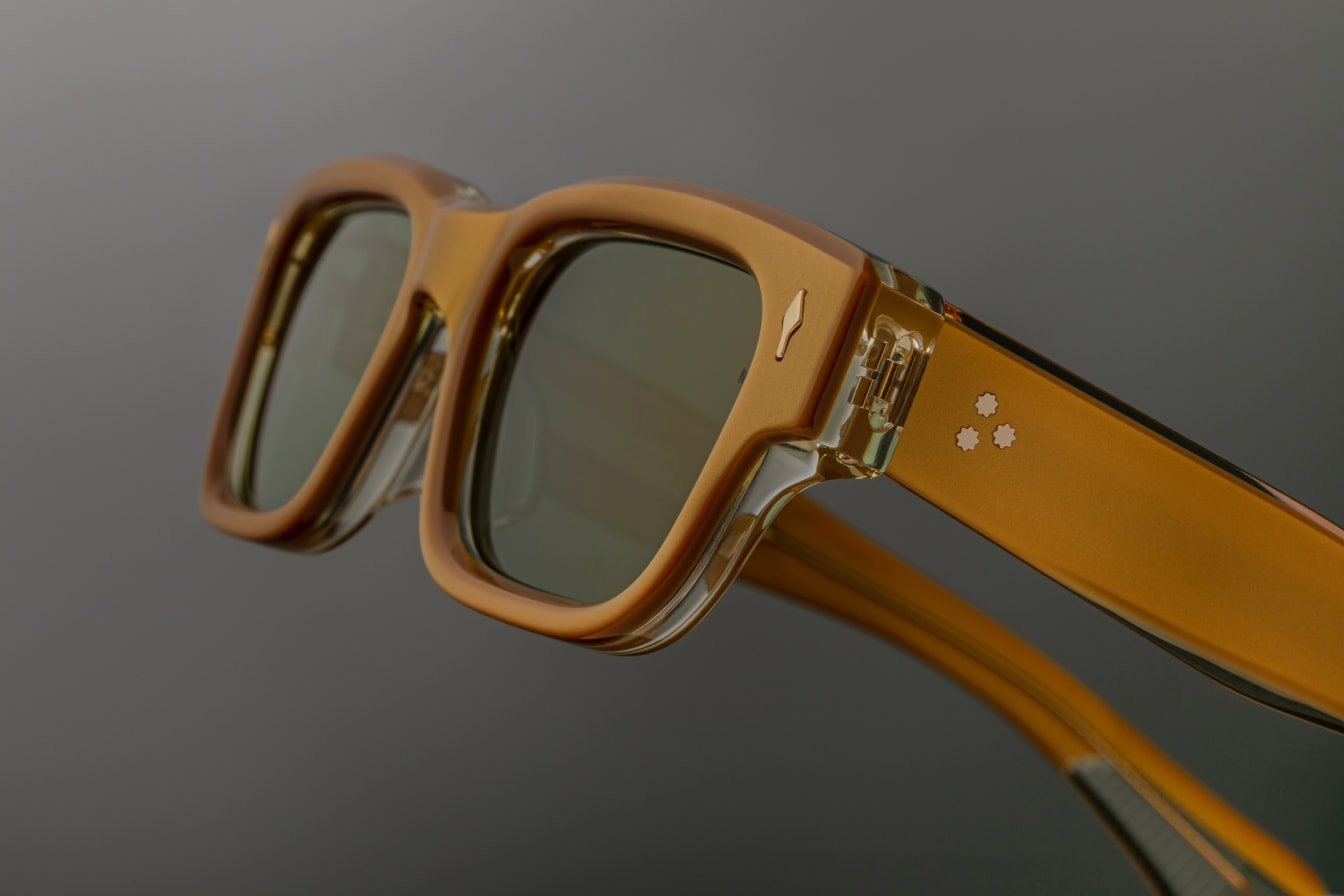 Close-up of the temples of Jacques Marie Mage Jeff sunglasses in Gold, focusing on the intricate gold-tone metal detailing at the temple ends. The temples are sleek, with engraved accents that add a touch of sophistication, while the frame’s curvature provides a comfortable fit