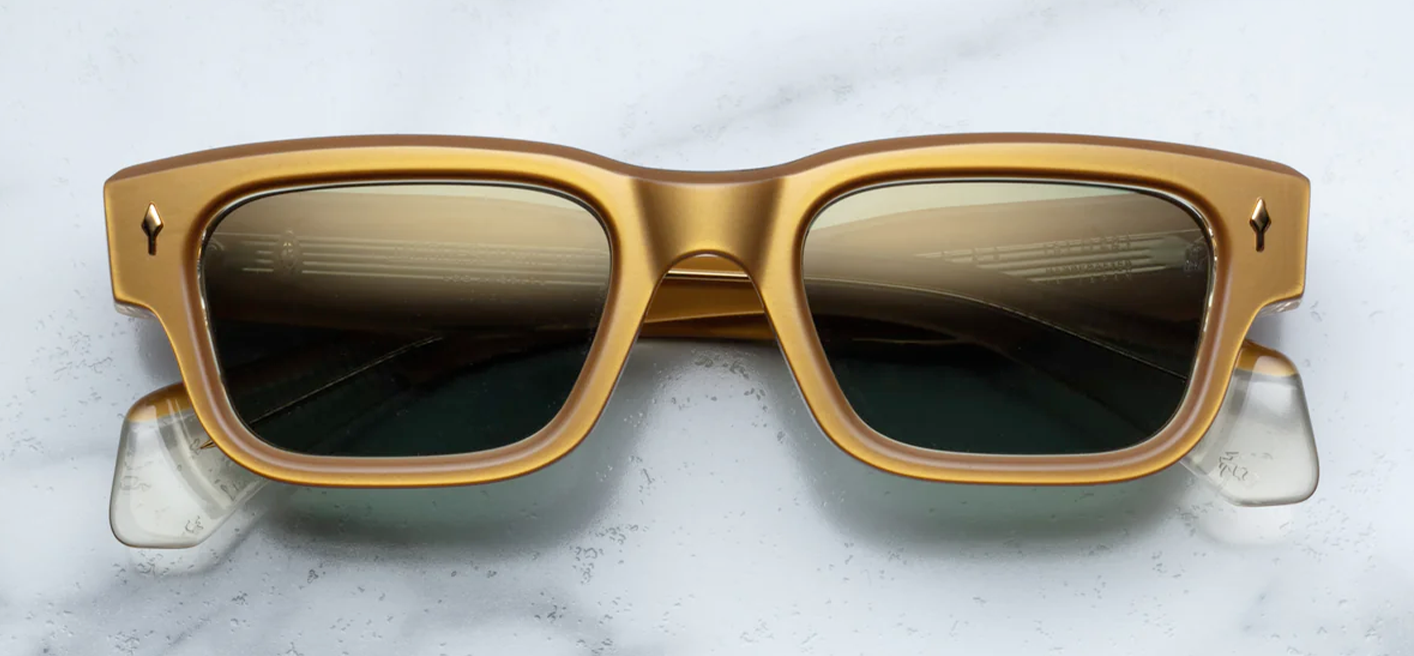 Front view of Jacques Marie Mage Jeff sunglasses in Gold, featuring a luxurious, oversized round frame in polished gold-tone metal. The frame’s bold, sculptural design is complemented by intricate detailing on the bridge and temples, offering a vintage-inspired yet contemporary look. The light, tinted lenses enhance the sophisticated, refined aesthetic