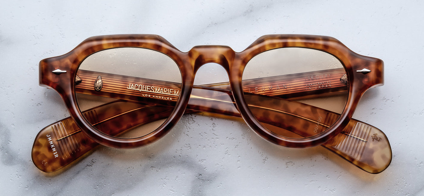 Front view of Jacques Marie Mage Kellerman in Camel: round sunglasses with thick camel‑havana acetate frame, prominent nose bridge, yellow CR39 lenses, signature metal arrowhead pin on each side of the front bezel