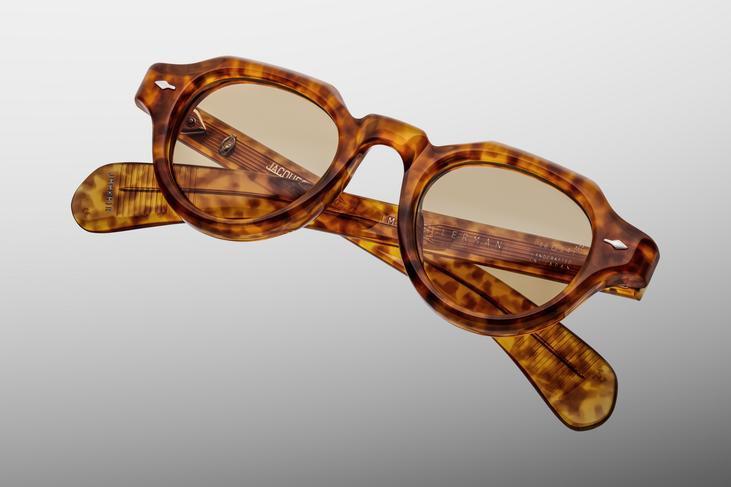 Top-down view of Jacques Marie Mage Kellerman sunglasses in Camel: reveals the smooth, polished surface of the acetate frame and the curvature of the lenses.