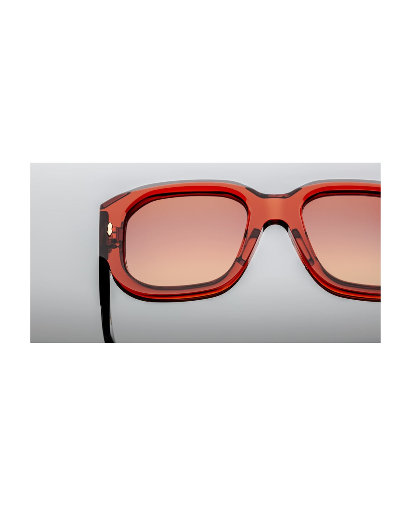 Jacques Marie Mage Lacy | Umber sunglasses: oversized square 7 mm burnt-orange cured acetate front and temples housing exposed silver wire-core. They feature dark-gold double‑arrowhead hinge pins, domed metal logo, and 2-base orange-gradient CR39 lenses with backside anti‑reflective coating and 100 % UV protection. Handcrafted in Japan, limited to 250 pieces