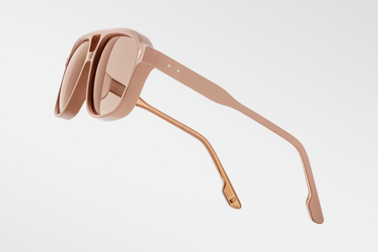 Close-up of the temple arm of Jacques Marie Mage Leonard Suede sunglasses in Dust Suede: displays the transition from the acetate frame to the metal core, showcasing the craftsmanship and design details. The Vauxhall wirecore with refined hairline details is visible.