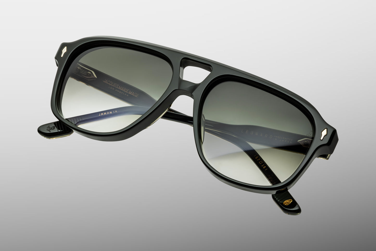 Close-up front view of Jacques Marie Mage Leonard Viper sunglasses featuring a refined 1980s-inspired navigator shape, double bridge and emerald gradient lenses