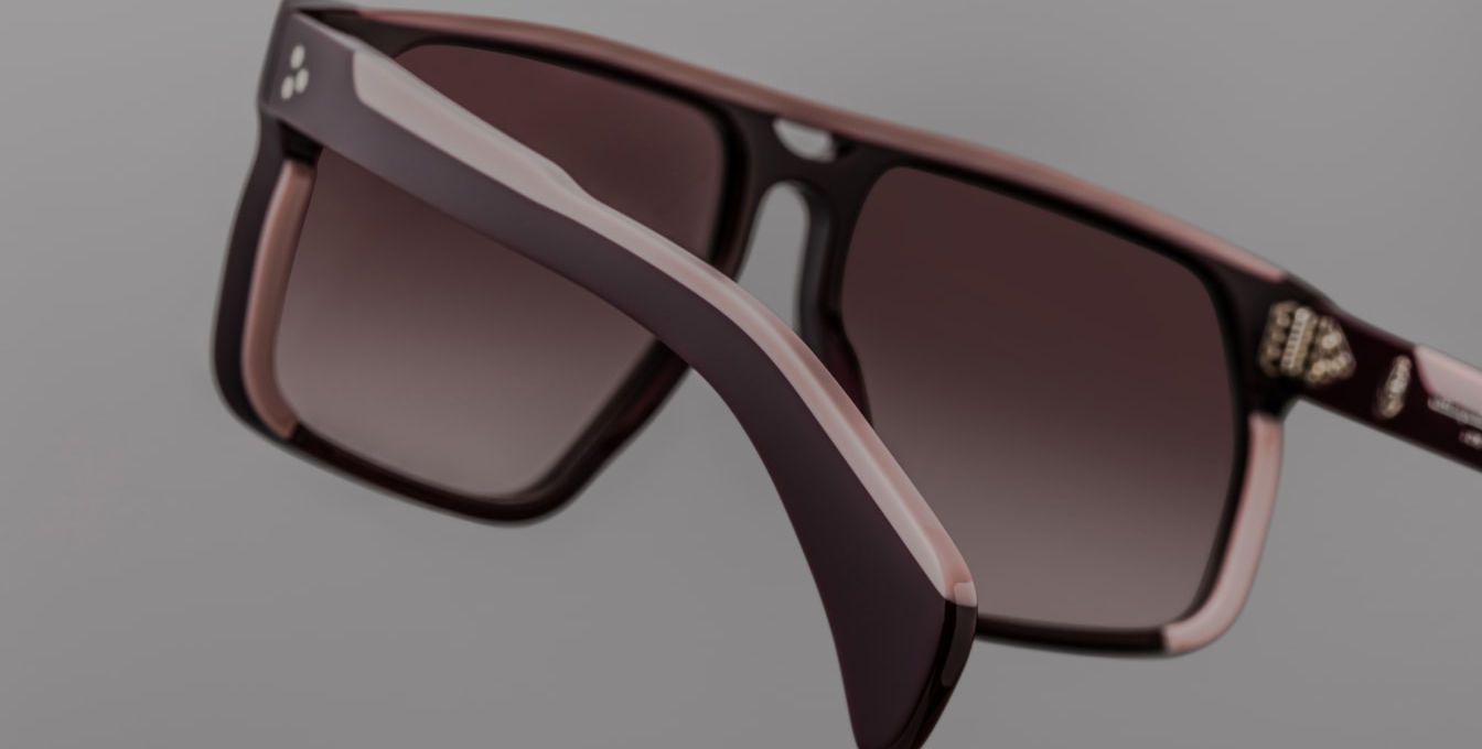 Back view Jacques Marie Mage limited‑edition Neptune aviator sunglasses in Port -cured purple acetate, handcrafted in Japan. Features 8 mm thick double‑laminated temples, hidden light‑gold wirecore, tension‑secured 7‑barrel hinges, 6‑base lenses with backside anti‑reflective coating, and full UV protection. Available at WINK Optometrists