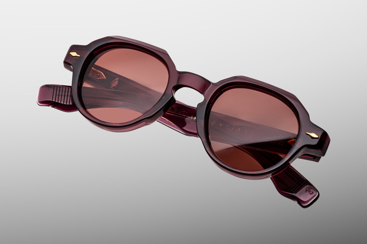 Top-down view of Pontian Amarena — broad keyhole bridge and sharply beveled brow in red acetate