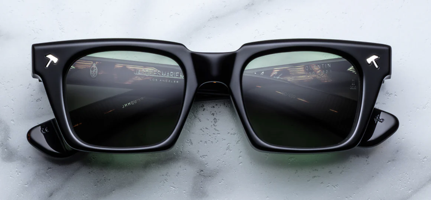 Front view of Jacques Marie Mage Johnny Cash II Quentin sunglasses in Noir 9: oversized rectangular frames in deep black acetate, featuring bold, hatchet-shaped silver front pins and a sculpted double-bridge design.