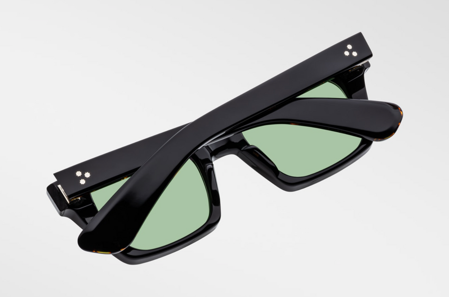 Bottom-up view of Jacques Marie Mage Johnny Cash II Quentin sunglasses in Noir 9: emphasizes the thickness of the acetate frame and the distinctive shape of the lenses. The polished silver wirecore is visible along the inner edge of the temples.