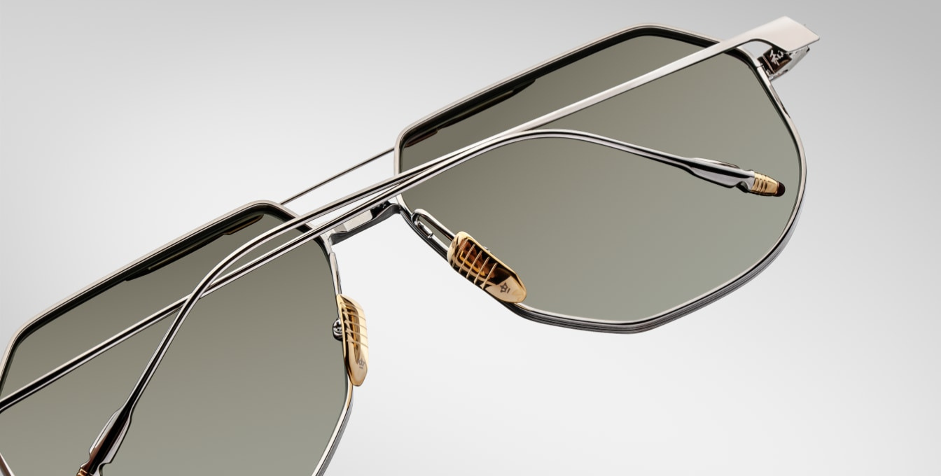 Back view of the Jacques Marie Mage Reynold Electrum an oversized, ’70s-inspired titanium aviator in silver and moon gold 100% beta titanium frame, engraved double bridge, signature tail‑fin temples with light bottle green gradient lenses. Limited to 500 handcrafted pieces. WINK Optometrists