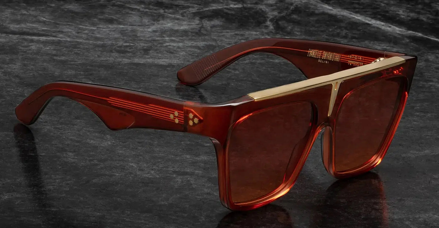 Jacques Marie Mage Selini Ruby side view showing thick red acetate temples, exposed silver wirecore and sculpted navigator profile
Side profile of JMM Selini Ruby sunglasses highlighting bold acetate construction and premium metal hardware