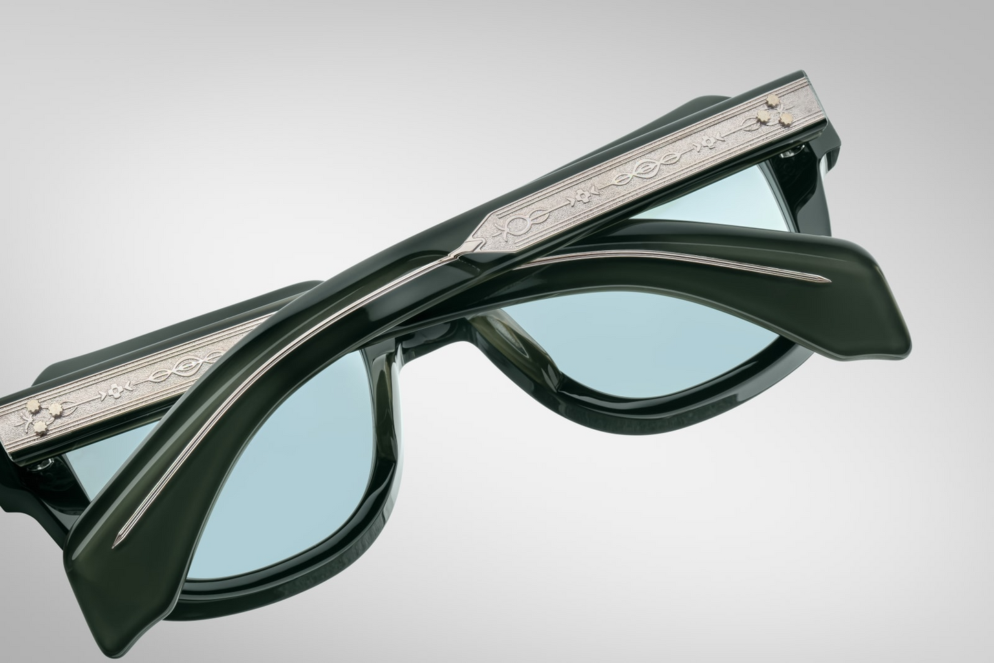 Interior view of JMM TAOS Mink: smooth inner acetate in mink finish, model & size engraved on inner temple (51‑20‑145), custom hinge assembly with tension elements, craftsmanship visible