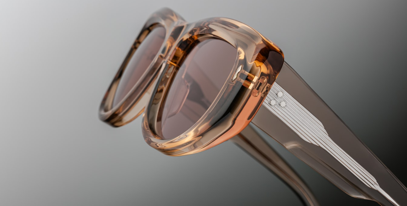 Silver wire core exposed temples in the Jacques Marie Mage The Sud | Simone sunglasses from the Erin Wasson x JMM collection in translucent “Clear Sand” acetate. Bronze tinted CR39 lenses with a 6 base curve, backside anti-reflective coating, and 100 % UV protection. Temple tips are inlaid with a polished silver Crest of Marseille emblem. Handcrafted in Japan as part of a limited run of 350