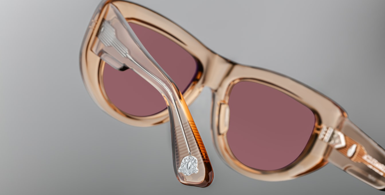 Jacques Marie Mage The Sud | Simone sunglasses from the Erin Wasson x JMM collection in translucent “Clear Sand” acetate. Bronze tinted CR39 lenses with a 6 base curve, backside anti-reflective coating, and 100 % UV protection. Temple tips are inlaid with a polished silver Crest of Marseille emblem. Handcrafted in Japan as part of a limited run of 350