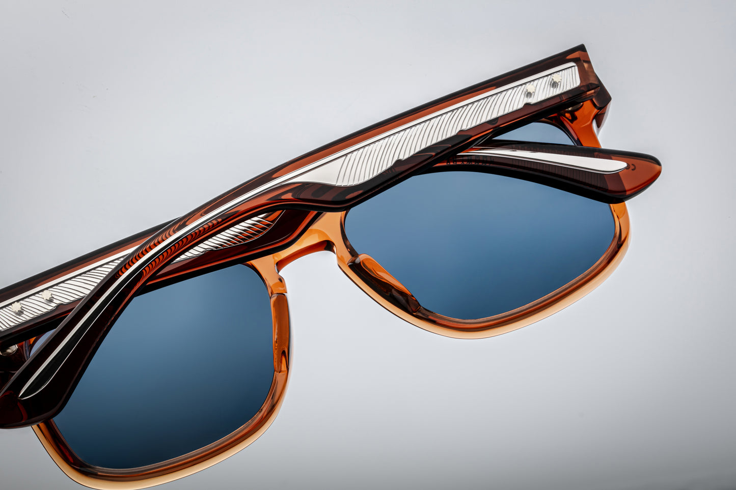 Rear view of Wesley Rootbeer — inside of the temples shows the layered acetate structure and tension-secured 5-barrel hinge.