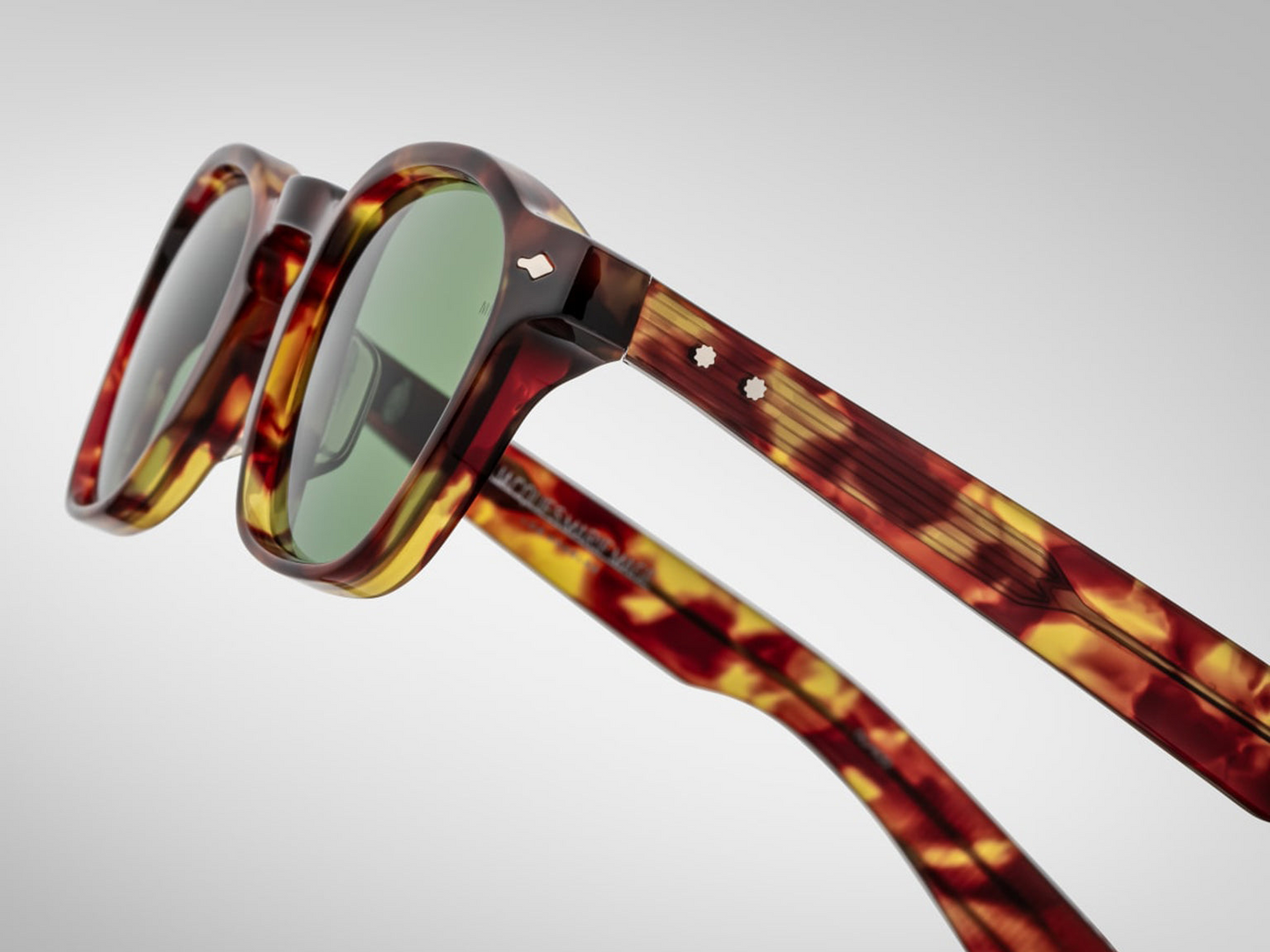 Side view of Zephirin Baltic by Jacques Marie Mage: thick double‑laminated acetate temples with silver wire‑core, hand‑polished finish, engraved model & serial on inner temple