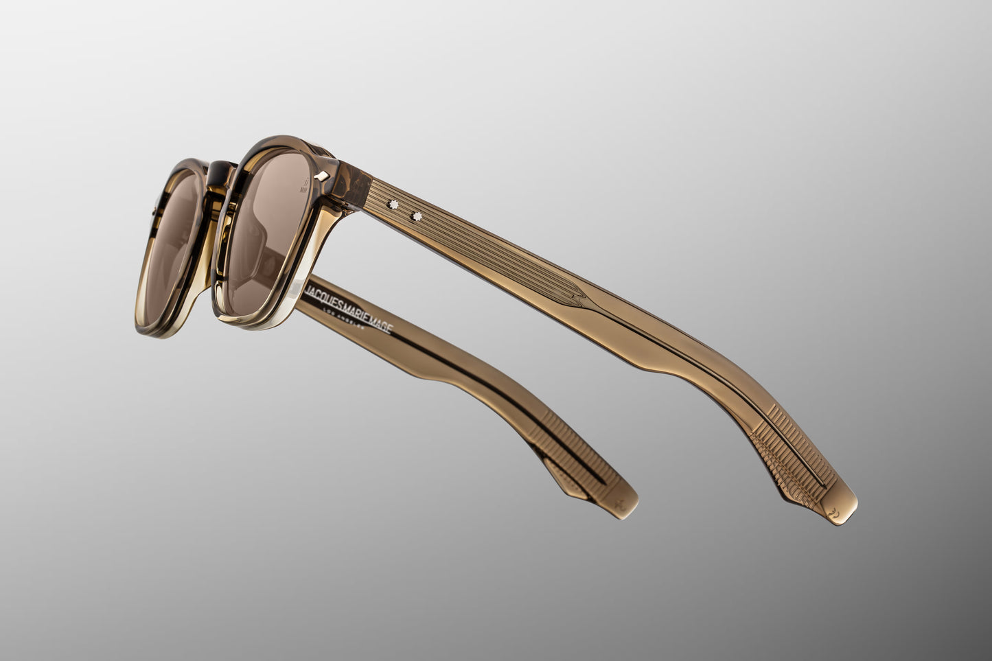 Close-up side detail of Jacques Marie Mage Zephirin Lescot showing engraved wire core, hinge construction and temple design
Macro side view of JMM Zephirin Lescot sunglasses highlighting silver hardware and layered acetate temples