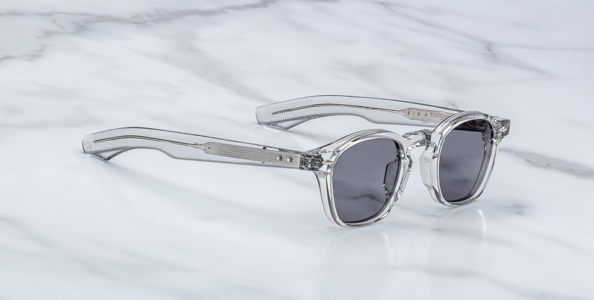 Side view of Zephirin Sulfur by Jacques Marie Mage: layered double‑laminated acetate temples in translucent frame, exposed silver wire‑core, silver tension‑secured custom 5‑barrel hinge with spur‑shaped sterling silver rivets