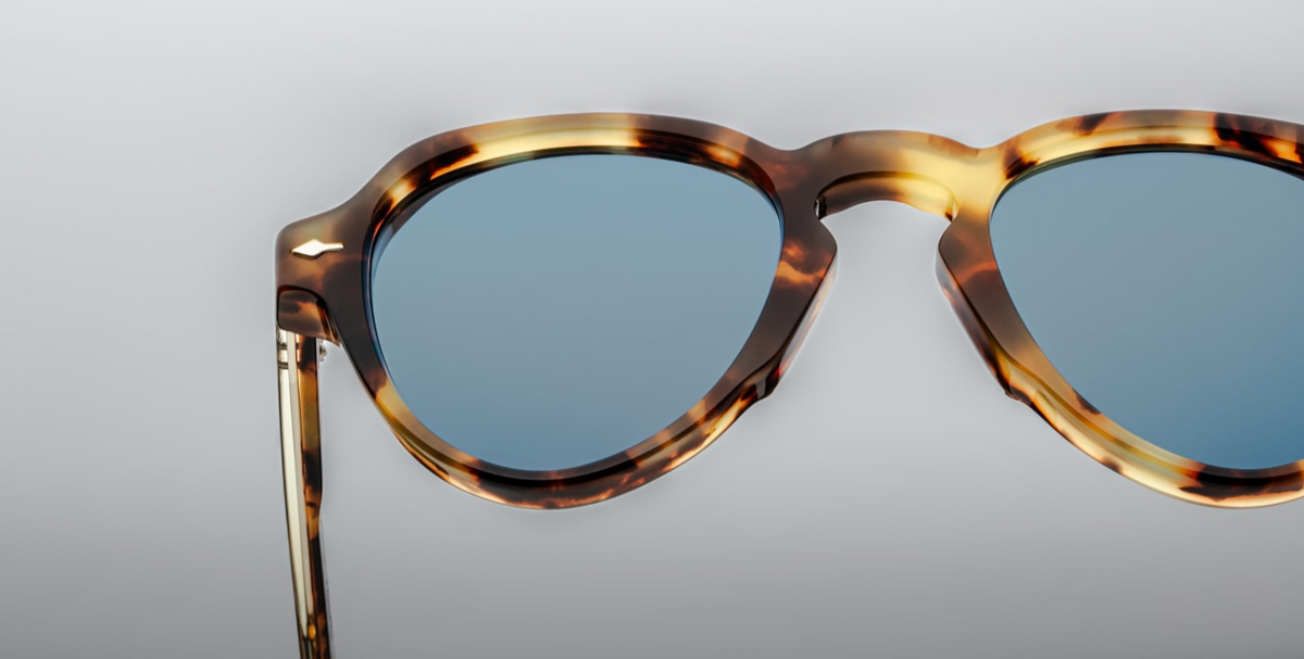 The blue CR39 lenses offer 100% UV protection and backside anti-reflective coating. Handcrafted in Japan, this limited-edition model is part of a 400-piece production run, combining retro aviator aesthetics with modern craftsmanship.