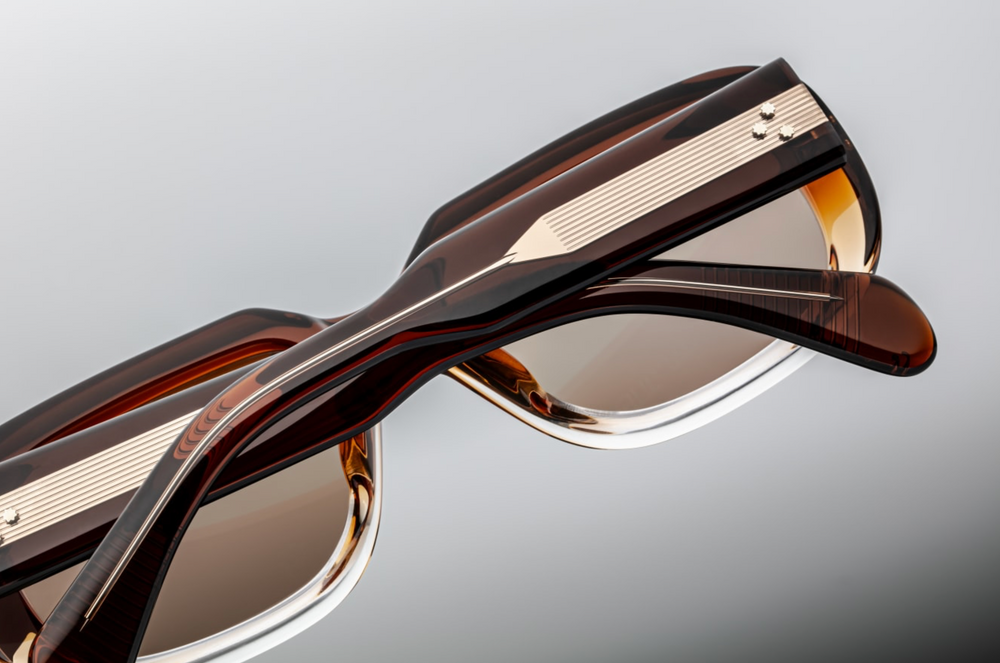 Side view of Jacques Marie Mage Kobo sunglasses in Hickory Fade, showcasing sculpted double-laminated acetate temples with intricate Native American-inspired engravings along an exposed dark gold wirecore, and a signature dark gold arrowhead front pin.
