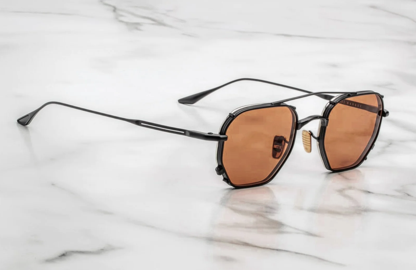 Right temple of Marbot Black — slim black beta‑titanium arm with exposed monoblock hinge and a custom detailed temple tip