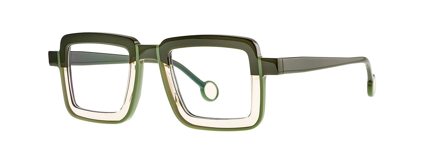 Theo Hinta eyewear in Musk & Olive color, featuring a unique geometric frame design with a combination of muted green and brown hues, displayed on a neutral background.