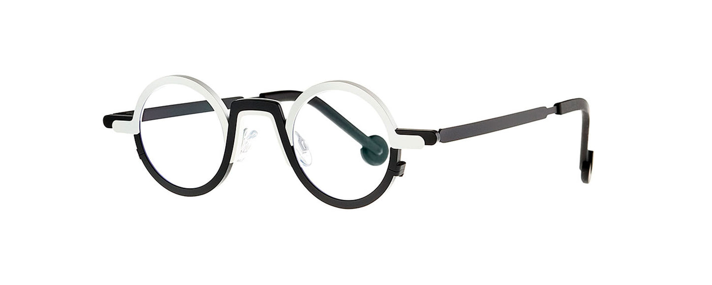 Theo Myeong Dong Black & White eyewear featuring a unique geometric design with a bold black and white color scheme, showcasing a modern and artistic style.
