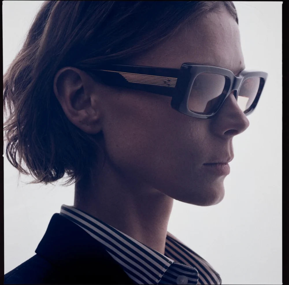 Profile of Supersonic Agar — thick double-laminated agar acetate temples revealing exposed wire-core and dark gold custom 9-barrel hinge