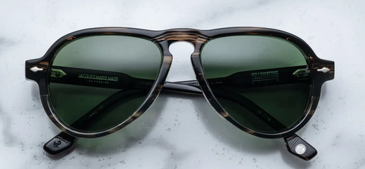 Front view of Jacques Marie Mage Druid Lodgepole aviator sunglasses in taupe tortoise 10 mm acetate with forest green polarized glass lenses, signature silver arrowhead front pins and sculptural aviator silhouette.