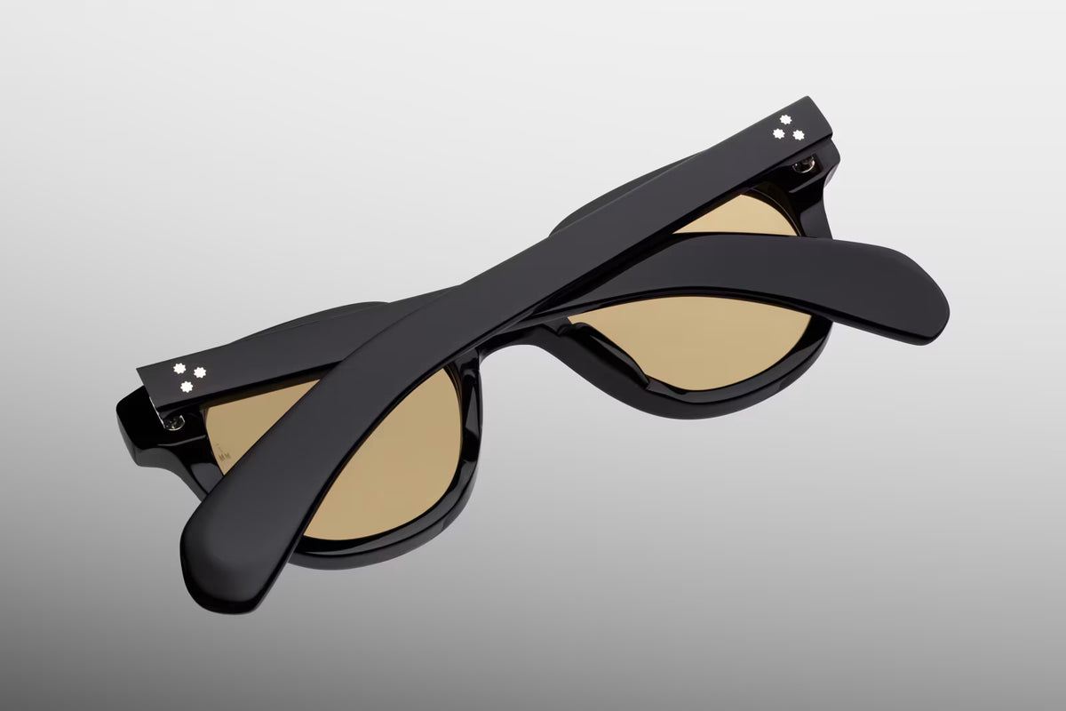 Rear perspective of the Jacques Marie Mage 1948 sunglasses in Willow. Displays the inside of the thick green frame, the back of the category 1 sepia lenses with anti-reflective coating, and the secure 7-barrel hinges connecting the temples.
