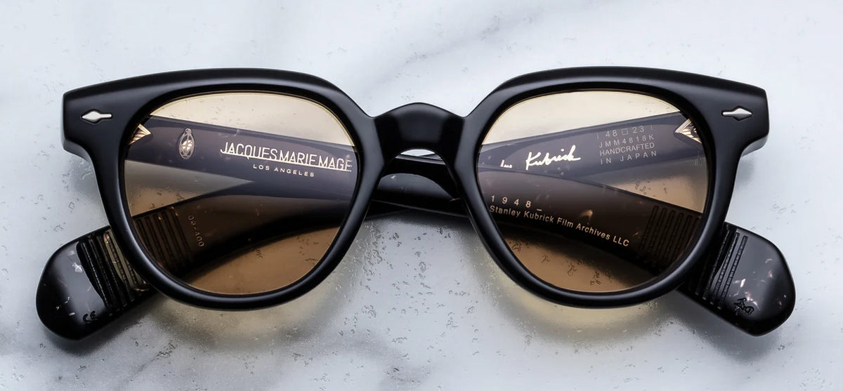 Front view of Jacques Marie Mage Stanley Kubrick 1948 sunglasses in Willow. Features a thick, mid-century rounded acetate frame in deep, translucent olive-toned Willow green, a robust keyhole bridge, signature sterling silver arrowhead front pins, and light sepia-tinted lenses.
