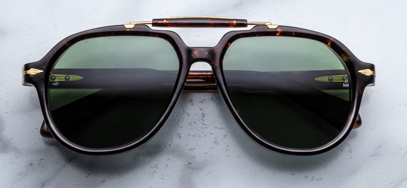 Front view of Jacques Marie Mage Ayrton Senna 1991 Agar aviator glasses in warm tortoise-style Agar cured cellulose acetate with signature 18K gold arrowhead embellishments and Tamarack Green polarised mineral lenses — handcrafted limited-edition collaboration inspired by Formula 1 legend Ayrton Senna